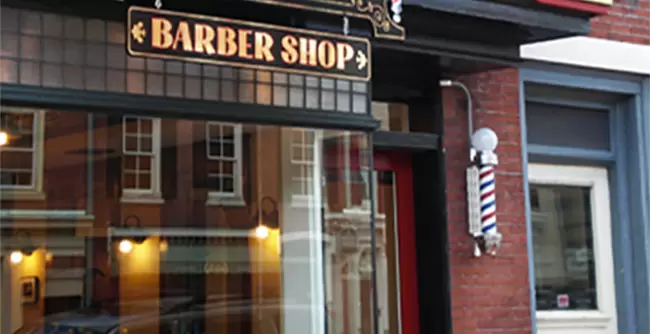 West Chester barber Shop exterior sign and barber poll